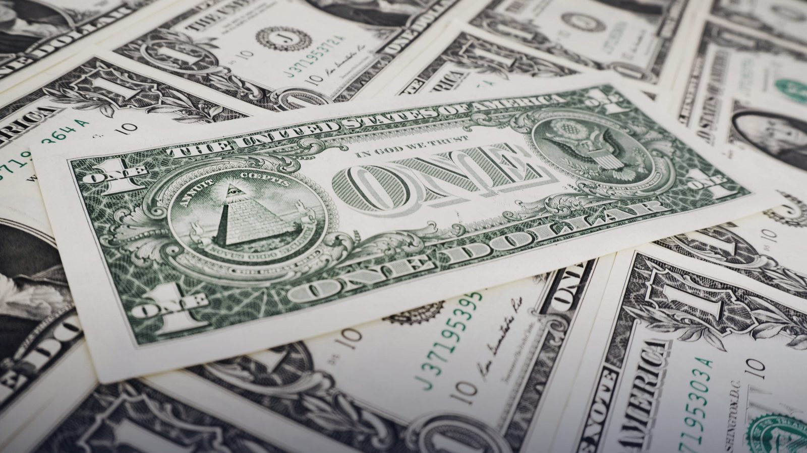 Scattered US one-dollar bills