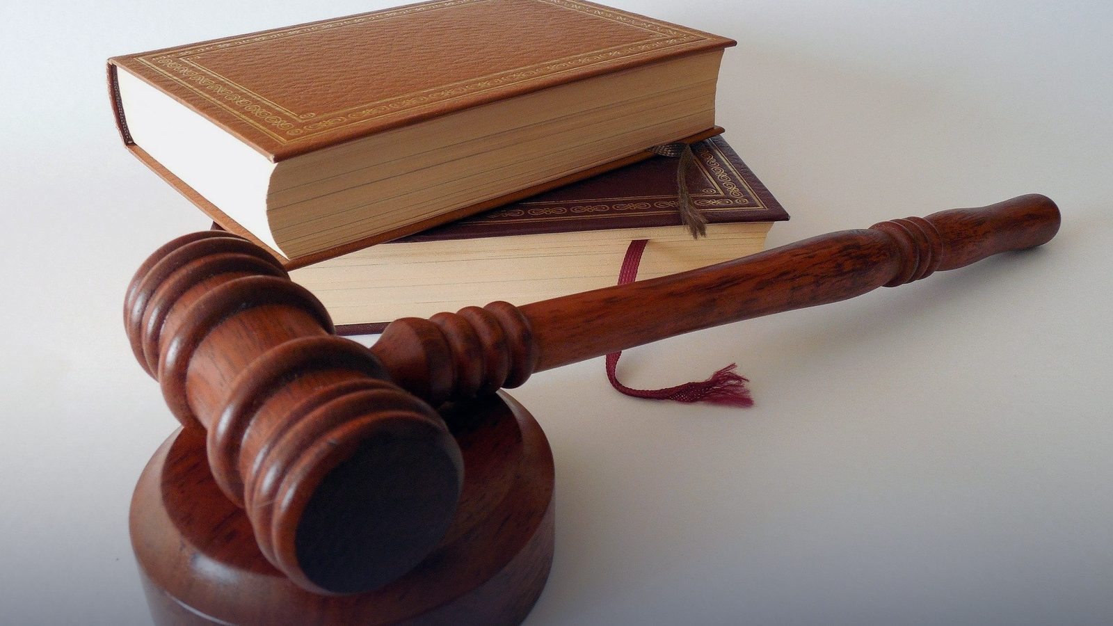 A wooden gavel on a sound block