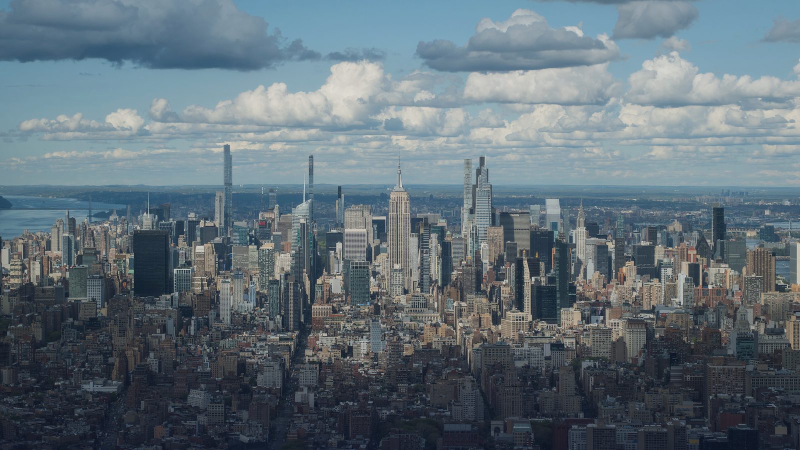 Midtown Manhattan skyline seen from above under a cloudy sky