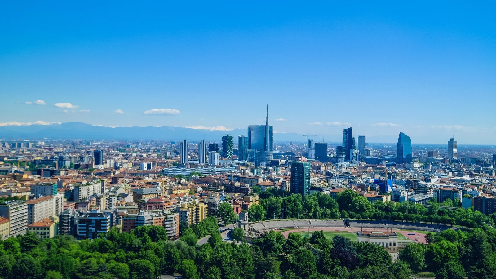Milan's skyline with the Porta Nuova business district towers and the Alps behind