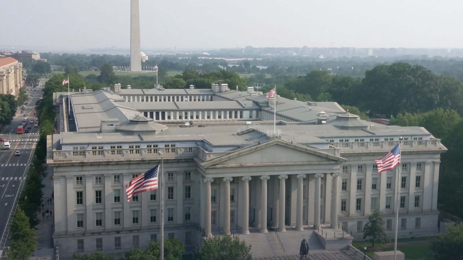 The US Treasury Building in Washington, seen from above, with the Washington Monument behind